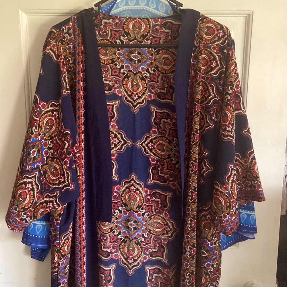 Calf length, one size fits all kimono. Never worn. New without tags.